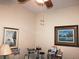 Bright office with two framed pictures and a ceiling fan at 24308 Belle Mede Dr, Leesburg, FL 34748