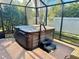 Hot tub with cover in a screened enclosure at 2458 Dunkirk Trl, The Villages, FL 32162