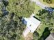 Aerial view of a single story home with a metal roof at 25143 Barrow Hl, Leesburg, FL 34748