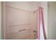 Bathroom with a shower/tub combo and pink curtain at 25143 Barrow Hl, Leesburg, FL 34748