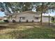 Front view of a single-story home with landscaping at 25143 Barrow Hl, Leesburg, FL 34748