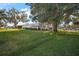 Single story home with a large yard and mature trees at 25143 Barrow Hl, Leesburg, FL 34748