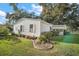 Side view of a single-story home with landscaping at 25143 Barrow Hl, Leesburg, FL 34748