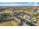 Aerial view of a community with houses, golf course, and lush green landscape at 25220 Waterbridge Ct, Leesburg, FL 34748