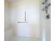 Walk-in shower with grab bar and tiled walls at 25220 Waterbridge Ct, Leesburg, FL 34748