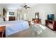 Spacious bedroom with a queen bed and ensuite bathroom at 25220 Waterbridge Ct, Leesburg, FL 34748