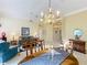 Bright dining room with chandelier and table at 25220 Waterbridge Ct, Leesburg, FL 34748