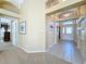 Entryway with view of a bedroom and the main entry door at 25220 Waterbridge Ct, Leesburg, FL 34748