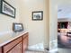 Hallway with wood cabinets and framed artwork at 25220 Waterbridge Ct, Leesburg, FL 34748