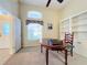 Bright home office with built-in shelving and window seat at 25220 Waterbridge Ct, Leesburg, FL 34748