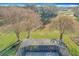 Aerial view of a screened enclosure with a lush green backyard at 25220 Waterbridge Ct, Leesburg, FL 34748