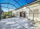 Large screened patio with view of backyard and blue sky at 25220 Waterbridge Ct, Leesburg, FL 34748