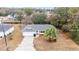 Aerial view of the house, showing the driveway and landscaping at 26 Pecan Pass Run, Ocala, FL 34472