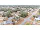 Aerial view showing a residential neighborhood with houses and roads at 26 Pecan Pass Run, Ocala, FL 34472