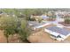 Aerial view of a home nestled among trees in a residential area at 26 Pecan Pass Run, Ocala, FL 34472