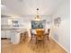 Dining area with wood table and chairs, hardwood floor at 26 Pecan Pass Run, Ocala, FL 34472