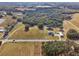 Aerial view of a large property with a house and surrounding land at 2685 Cr 564, Bushnell, FL 33513