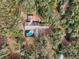 Aerial view of the house nestled amongst the trees at 2685 Cr 564, Bushnell, FL 33513