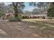 Large backyard with mature trees and house view at 2685 Cr 564, Bushnell, FL 33513