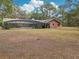 Ranch-style brick home with a large backyard and pool at 2685 Cr 564, Bushnell, FL 33513