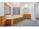 Main bathroom with double vanity and corner tub at 2685 Cr 564, Bushnell, FL 33513