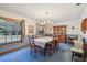 Formal dining room with large table, chandelier, and wood hutch at 2685 Cr 564, Bushnell, FL 33513