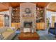 Brick fireplace with built-in shelving, creating a cozy focal point in the living room at 2685 Cr 564, Bushnell, FL 33513