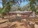 Brick house with mature trees surrounding the property at 2685 Cr 564, Bushnell, FL 33513