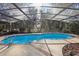 Inviting kidney-shaped pool with a screened enclosure at 2685 Cr 564, Bushnell, FL 33513