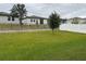 Large grassy backyard with a black metal fence at 29320 Armoyan Blvd, Leesburg, FL 34748