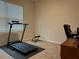 Home office featuring a treadmill and desk at 29320 Armoyan Blvd, Leesburg, FL 34748