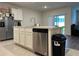 Kitchen island with sink and dishwasher at 29320 Armoyan Blvd, Leesburg, FL 34748