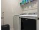 Laundry room with washer, dryer, and shelving at 29320 Armoyan Blvd, Leesburg, FL 34748