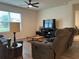 Living room with two sofas and a TV at 29320 Armoyan Blvd, Leesburg, FL 34748