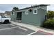 Community pool bathroom with green exterior at 29320 Armoyan Blvd, Leesburg, FL 34748