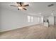 Open living space with tile flooring and kitchen view at 29360 Caspian St, Leesburg, FL 34748