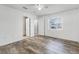 Well-lit bedroom with wood-look floors and ample closet space at 2941 Tangerine Ct, Leesburg, FL 34748