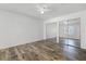 Spacious bedroom with mirrored closet doors and wood-look floors at 2941 Tangerine Ct, Leesburg, FL 34748