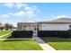 Exterior view showing house with a screened lanai and pond view at 2941 Tangerine Ct, Leesburg, FL 34748