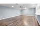 Large living area with wood-look floors and light walls at 2941 Tangerine Ct, Leesburg, FL 34748