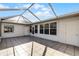 Spacious screened patio with tile flooring and a glass roof at 2941 Tangerine Ct, Leesburg, FL 34748