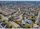 Aerial view highlighting a single-Gathering house in a quiet neighborhood at 307 Batesburg Way, The Villages, FL 32162