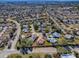 Aerial view of house nestled in a residential neighborhood at 307 Batesburg Way, The Villages, FL 32162