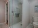 Shower stall with glass enclosure and tiled walls at 307 Batesburg Way, The Villages, FL 32162