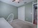 Bedroom with white desk and double doors at 307 Batesburg Way, The Villages, FL 32162