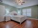 Main bedroom with hardwood floors and white bedroom set at 307 Batesburg Way, The Villages, FL 32162