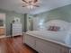 Spacious bedroom with hardwood floors and a dresser at 307 Batesburg Way, The Villages, FL 32162