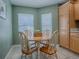 Charming dining area with round table and four chairs at 307 Batesburg Way, The Villages, FL 32162