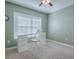 Home office with white desk and chair at 307 Batesburg Way, The Villages, FL 32162