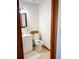 Small bathroom with white vanity and toilet at 31 Sand Lake Pl, Eustis, FL 32726